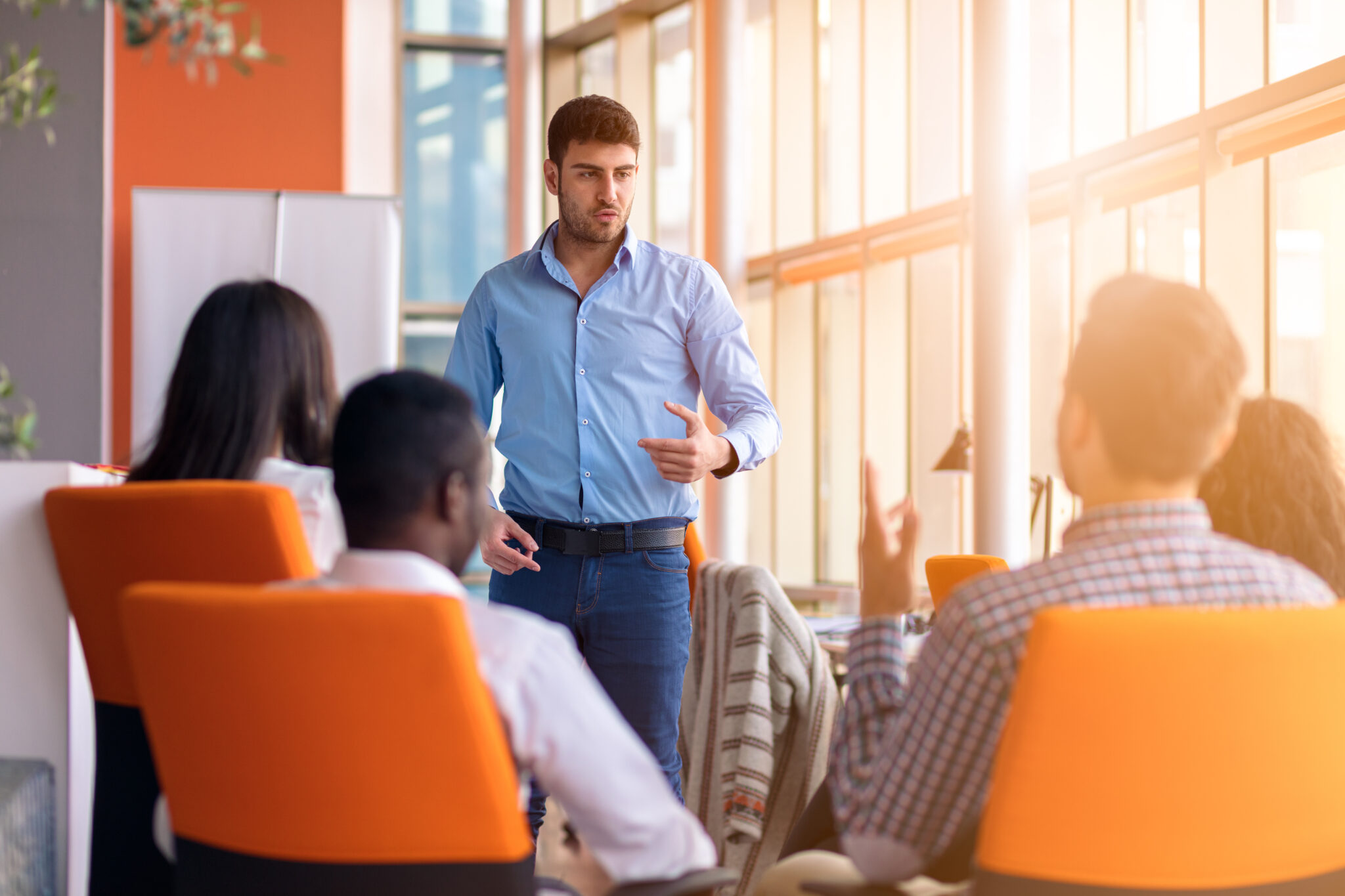 Business meeting in a modern office with young people .